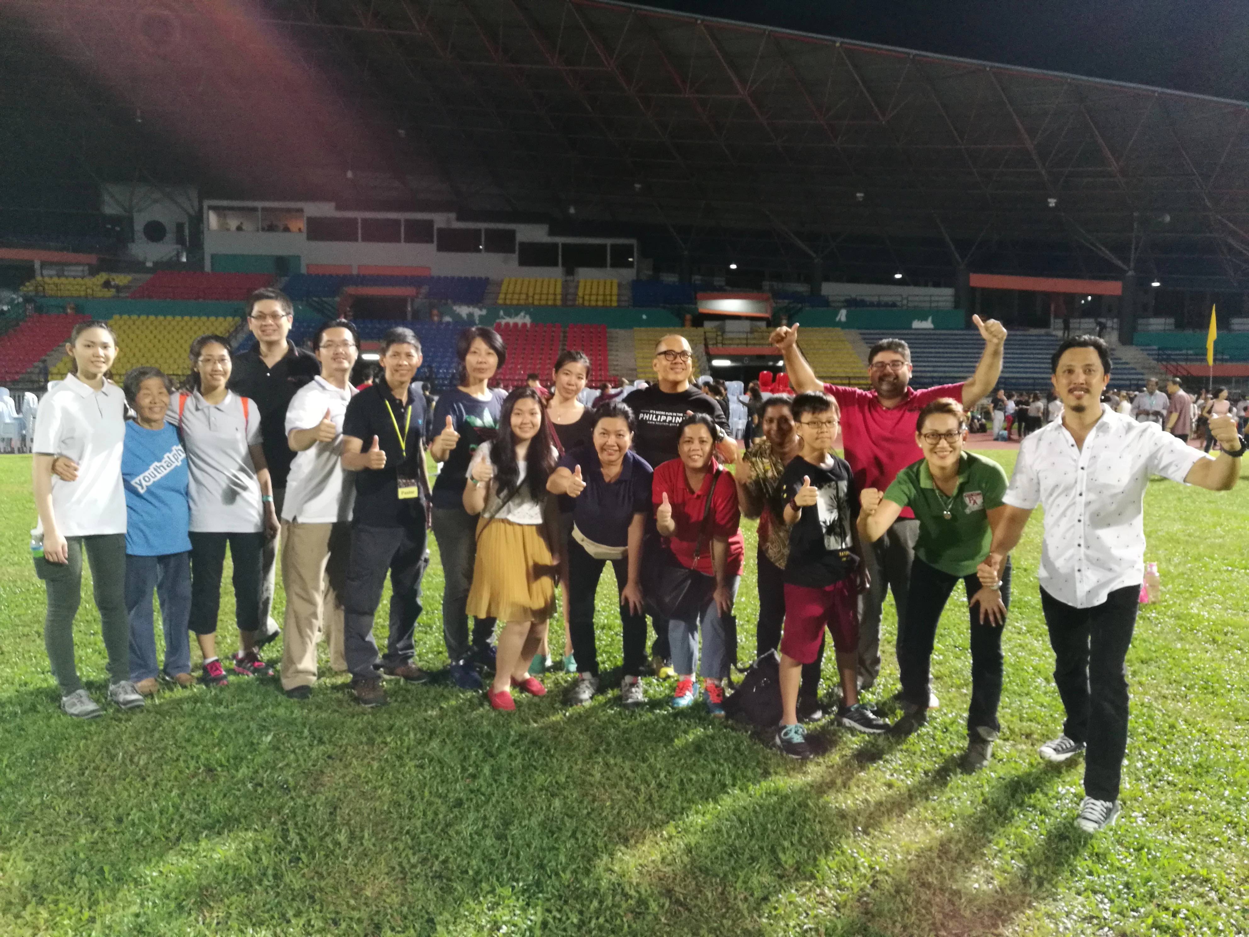 Victory Community Centre members at a stadium gathering